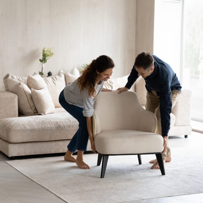 Spouses,Carrying,Modern,Armchair,,Placing,Furniture,Relocating,Into,New,Home.